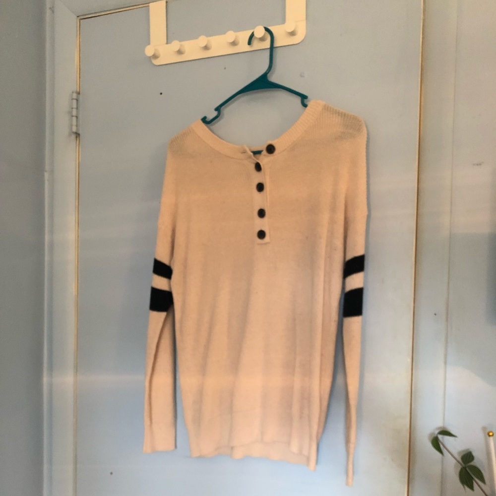 Cream & Black partial button-up sweater. Relatively loose fitting. Hardly worn.